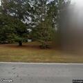 Suspicious person moving items in front yard