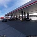 Customer arguing with staff outside gas station