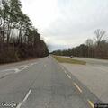 Officer checks on woman walking along highway