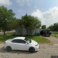 Person knocking on windows at Hickory Street home