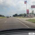 Traffic stop on white Ford Fusion at gas station
