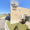 Officer checks blue truck behind Gardendale business
