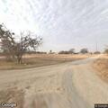 Person running toward rodeo grounds property