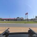 EMS standing by outside Red Roof Inn near State Police Troop G