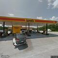 Disabled car at gas station on Atlantic Avenue