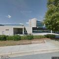 Pregnant woman in black car outside Emory Hillandale Hospital