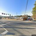 Person found sleeping on grass at highway intersection