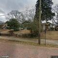 Man knocking on bedroom window at Atlanta home