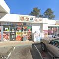 Car damaged by manhole cover at gas station