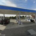 Male person reported with head pain at Chevron on Beach Blvd