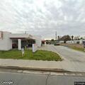 Broken glass reported in roadway near liquor store