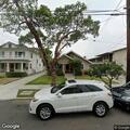 Person knocking on doors with dog in Long Beach