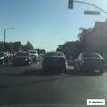 Man with club hitting vehicles on East 7th Street
