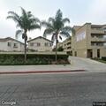Person unconscious in front of apartment complex