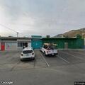 Person passed out but breathing at industrial place