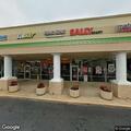 Person deterring customers at front of building