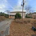 Officer contact with blue vehicle at business