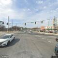 Traffic lights flashing red at busy intersection