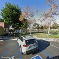 Person experiencing head pain at Central Park parking lot
