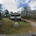 Unresponsive man standing in front yard on Spring Street