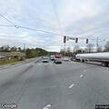 Person in wheelchair blocking busy intersection