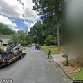 Traffic stop with white Porsche on Winding Lane