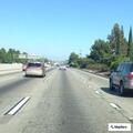 Stopped SUV on highway shoulder near Artesia