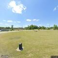 Car pouring gasoline in Lake City park
