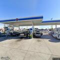 Woman arguing with gas station clerk