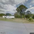 Structure fire with flames spreading to trees