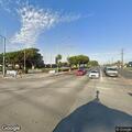 Woman throwing objects at cars near intersection