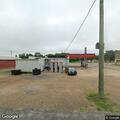 Person Having Difficulty Breathing at House Behind Texaco