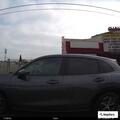 Person yelling for help inside parked vehicle