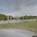 Woman pushing cart in traffic on Seaside Road
