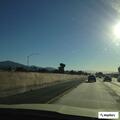 Brush fire in wash south of freeway