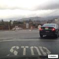 Driver in white Honda traveling slowly on Juniper Avenue