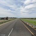 Semi driving with trailer doors open on highway