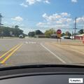 Officer checks vehicles at gas station
