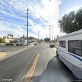 Outdoor fire near railroad tracks in Maywood