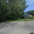 Car blocking stop sign at intersection