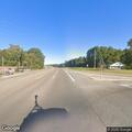 Disabled vehicle partially blocking roadway