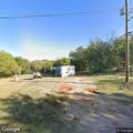 Trash fire in small utility trailer near home