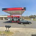 Person having difficulty breathing at gas station