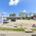 Suspicious male lying on sidewalk in Saluda