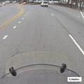 Kia minivan and box truck crash behind business