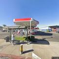 Person experiencing chest pains at gas station