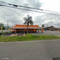 Pedestrian standing in lanes near Mentone restaurant
