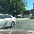 Woman throwing items on West Sunset Boulevard