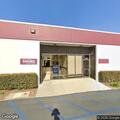 Person experiencing abdominal pain at California gas station