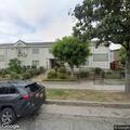 Person experiencing abdominal pain at residence in Alhambra
